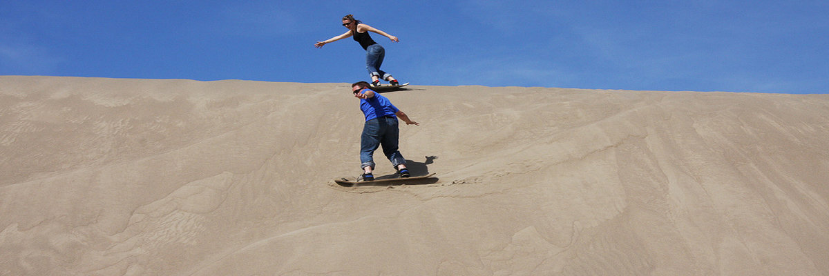 Sandboarding on the White hill in Ica en Nazca